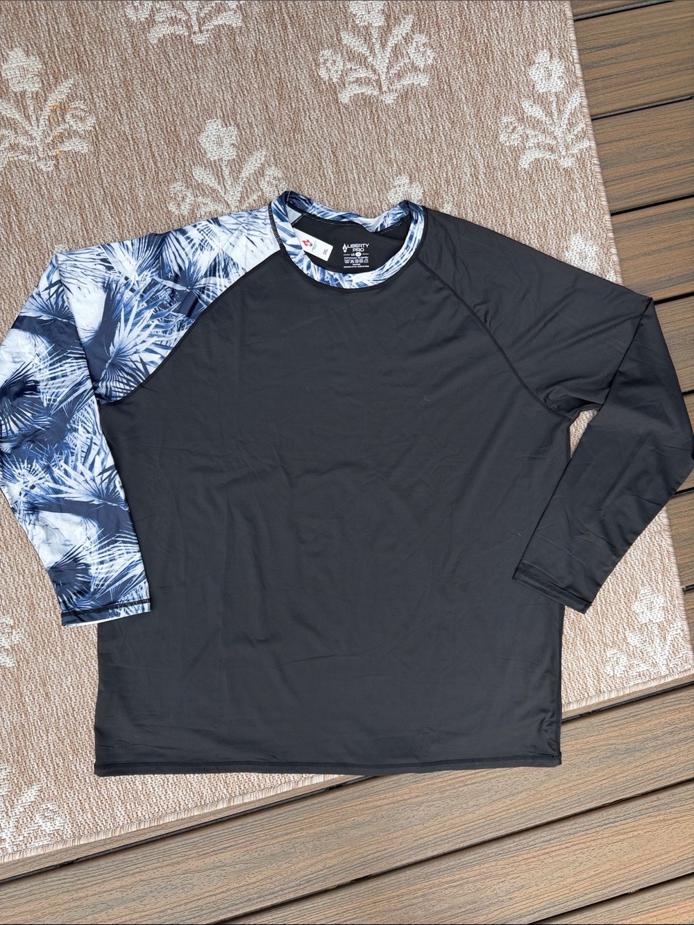 NWT Liberty Pro Black Long Sleeve Rash Guard with Blue Palm Patterned Sleeve